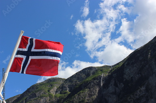 Norwegian flag on a river boat in Geirangerfjord near Geiranger, Norway