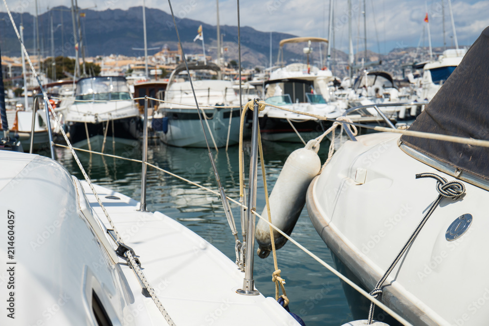 Inside a sailing boat on a summer sun day at the marina about to take the helm and leave sailing the sea in. Inside a sailing boat on a summer sun day at the marina about to take the helm and leave sailing the sea in.