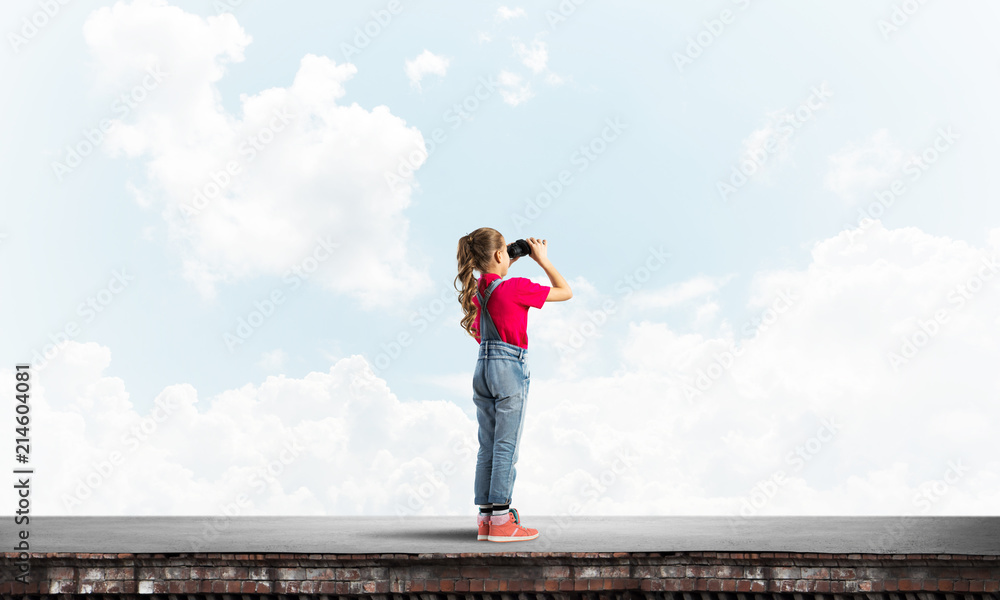 Concept of careless happy childhood with girl of school age looking in future Concept of careless happy childhood with girl of school age looking in future