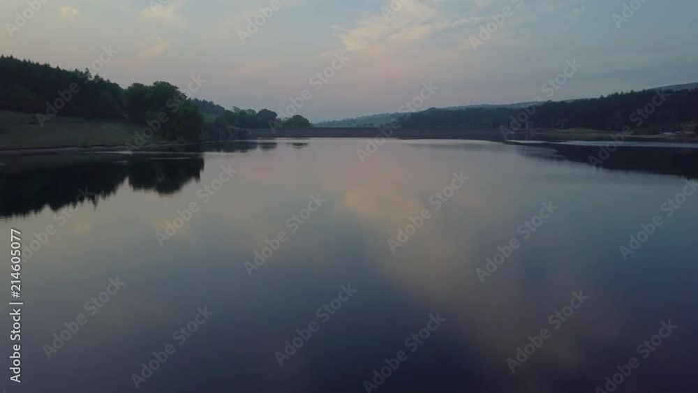 Drone flying over calm reservoir. Drone flying over calm reservoir.
