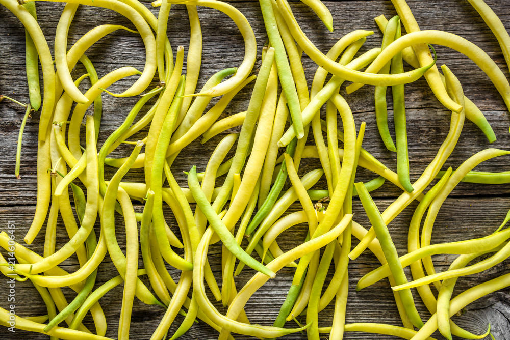 Yellow bean, fresh vegetables on farmer market, freshly harvested beans, flat lay background