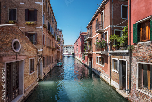 Traditional canal street and colorful Venetian houses in Venice, Italy.