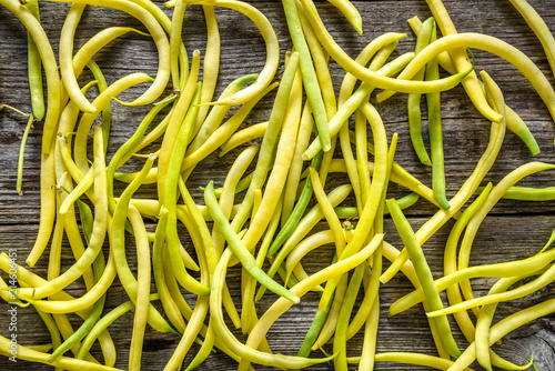 Yellow bean, fresh vegetables on farmer market, freshly harvested beans, flat lay background © alicja neumiler