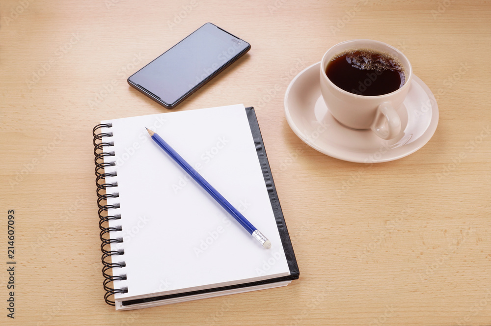 desk with stationery phone and cup of coffee desk with stationery phone and cup of coffee