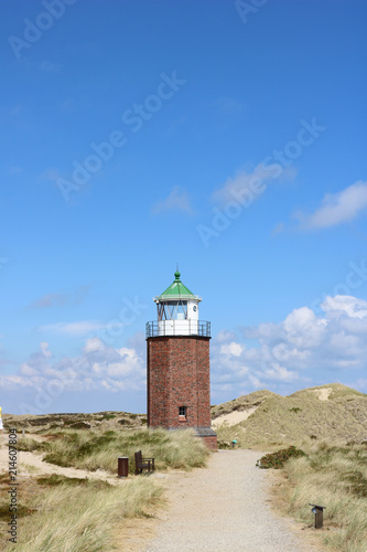 Landscape of Rotes Kliff lighthouse, on the island of Sylt, Germany, located on a cliffside north of the village of Kampen. © Anna