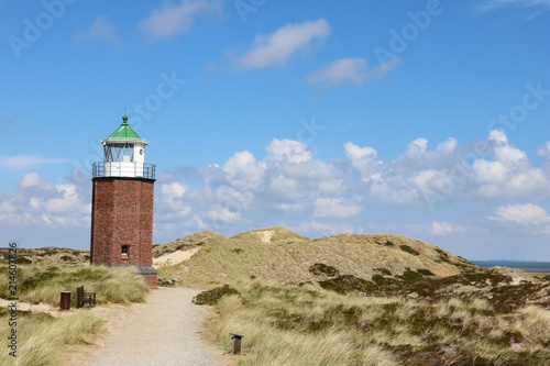 Landscape of Rotes Kliff lighthouse, on the island of Sylt, Germany, located on a cliffside north of the village of Kampen. © Anna