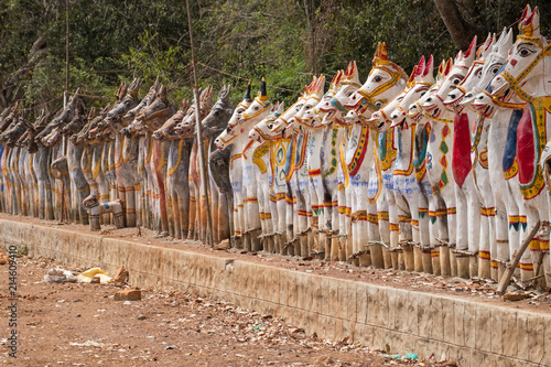 Clay horses assembled in homage to the Hindu god Ayyanar surrounding the Solai Andavar temple at Pallathur in Tamil Nadu. Ayyanar is the mythical guardian of local villages photo