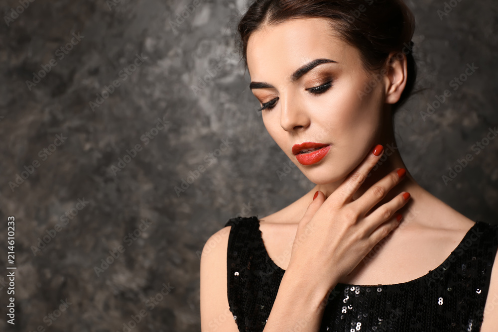 Young woman with beautiful manicure on dark background Young woman with beautiful manicure on dark background