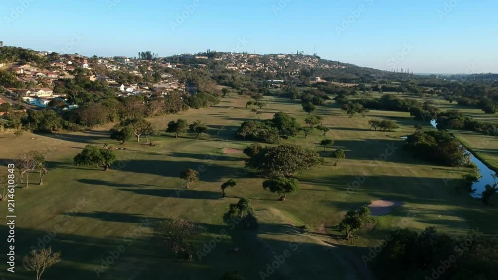 Aerial view of landscape around Durban, South Africa. Flying backwards and away from a residential area on the horizon. Aerial view of landscape around Durban, South Africa. Flying backwards and away from a residential area on the horizon.