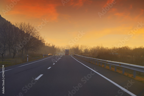 Sunset on the road with golden sky