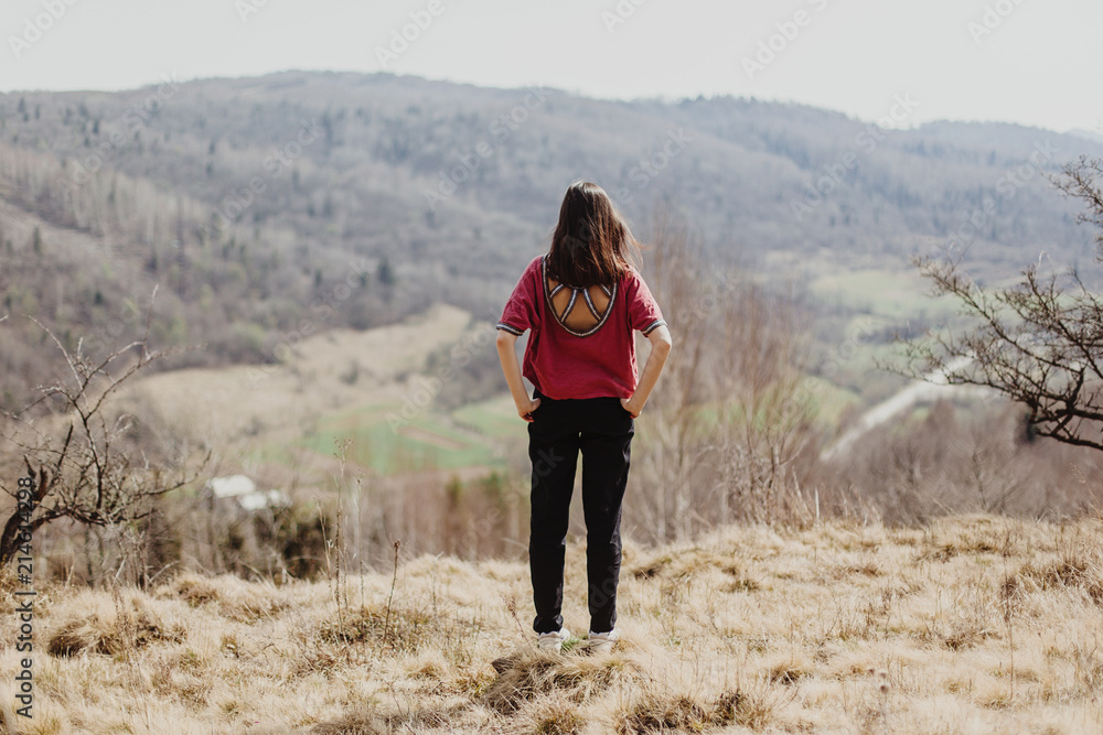 happy stylish hipster woman standing on top of hill mountain, cheerful moment of happiness happy stylish hipster woman standing on top of hill mountain, cheerful moment of happiness