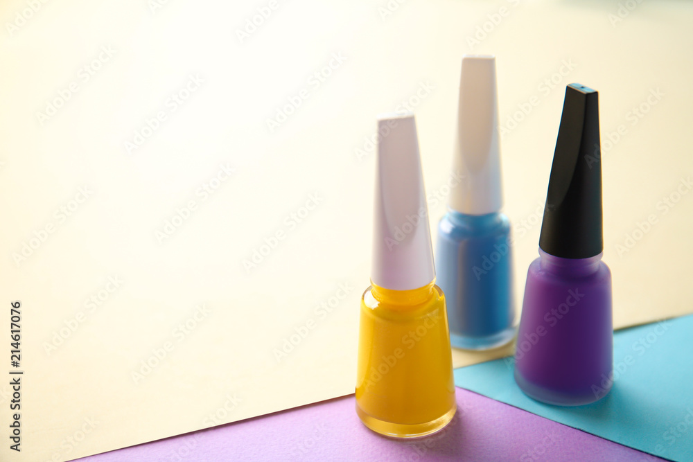 Bottles of nail polishes on color background Bottles of nail polishes on color background