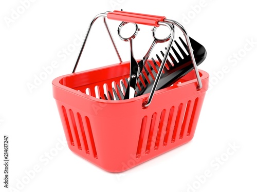 Barber scissors with comber inside shopping basket photo