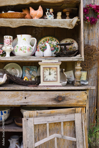 garden, kitchen tools and flowerpots on wood shelf