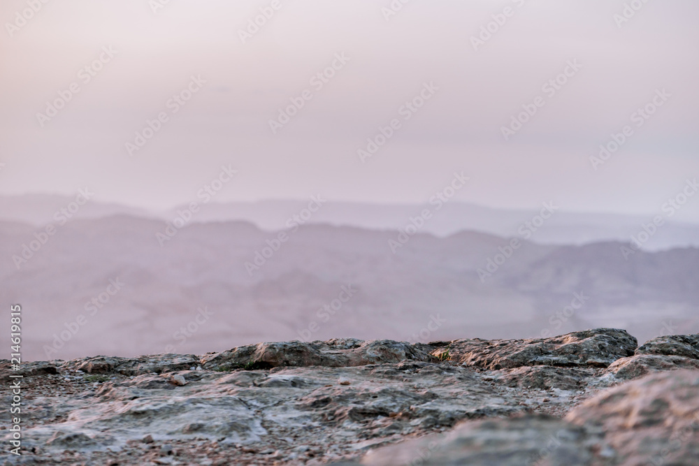 Obraz premium Sunrise in Israel dry negev desert. Amazing view on mountaines, rocks and sky. National park makhtesh ramon with beautiful landscapes