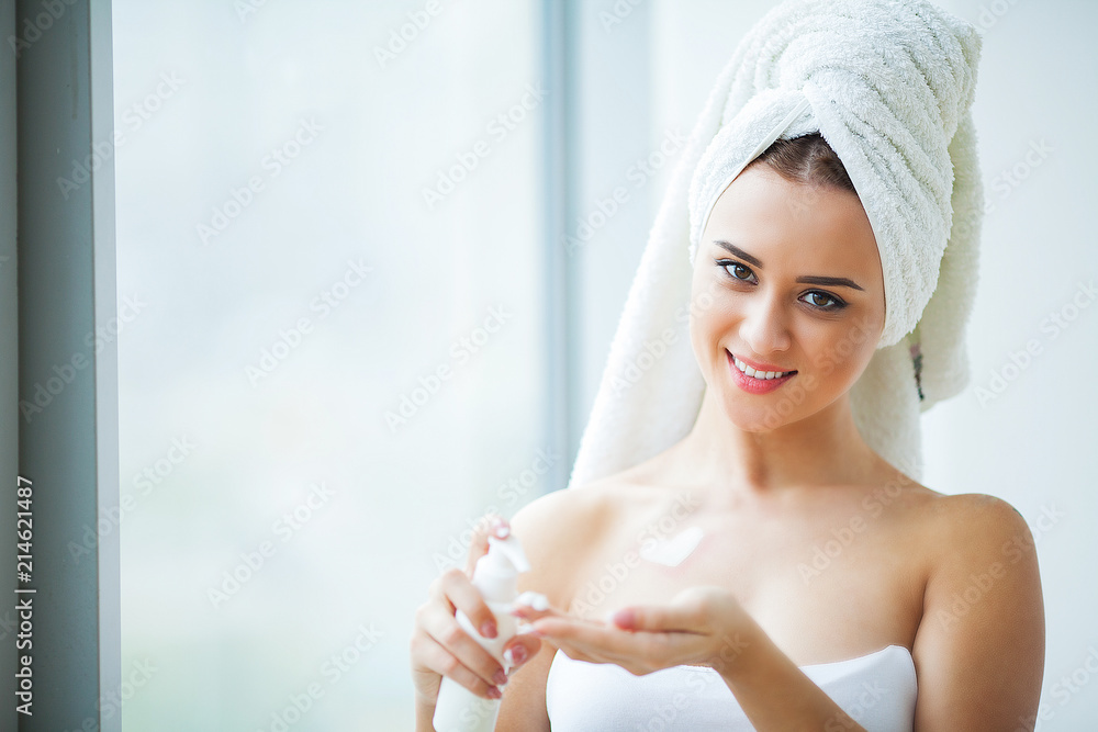 Beauty Face Care. Woman Applying Cream On Skin Beauty Face Care. Woman Applying Cream On Skin