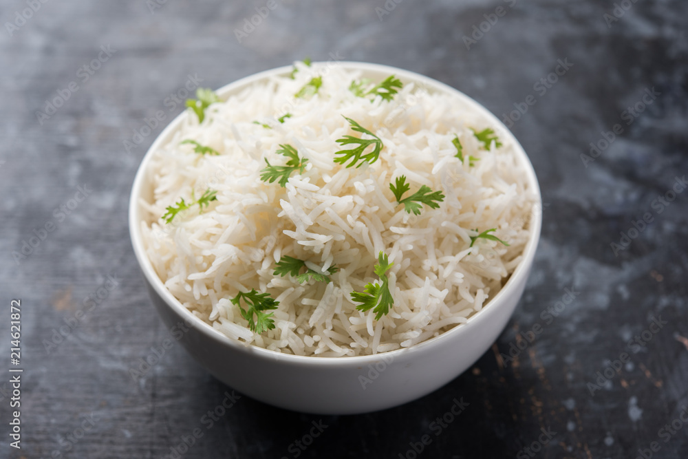 Coriander or cilantro Basmati Rice, served in a ceramic or terracotta bowl. It's a popular Indian OR Chinese recipe. Selective focus Coriander or cilantro Basmati Rice, served in a ceramic or terracotta bowl. It's a popular Indian OR Chinese recipe. Selective focus