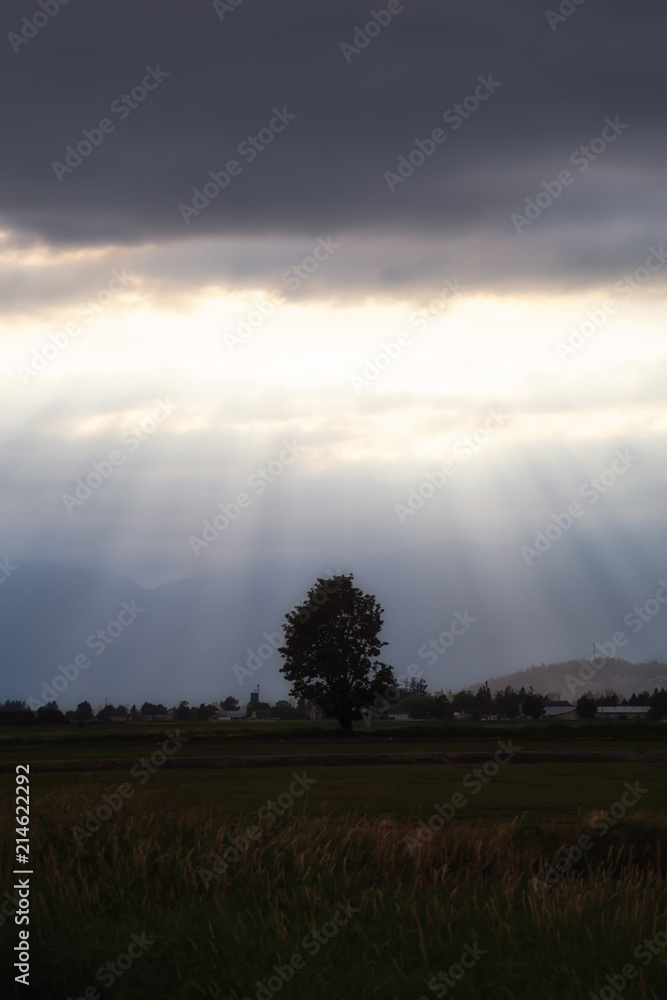 Striking view of the country side during a dramatic sunset. Taken in Chilliwack, East of Vancouver, BC, Canada.