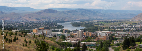 Aerial panoramic view of Kamloops City during a cloudy summer day. Located in Interior BC, Canada. photo