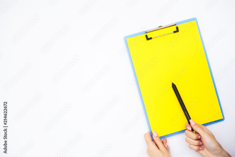 Blank Folder with Yellow Paper. Hand that Holding Folder and Handle on White Background. Copyspace. Place for Text Blank Folder with Yellow Paper. Hand that Holding Folder and Handle on White Background. Copyspace. Place for Text