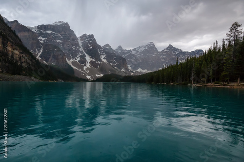 Beautiful Canadian Rockies during a cloudy and rainy evening. Taken in Moraine Lake, Banff National Park, Alberta, Canada.
