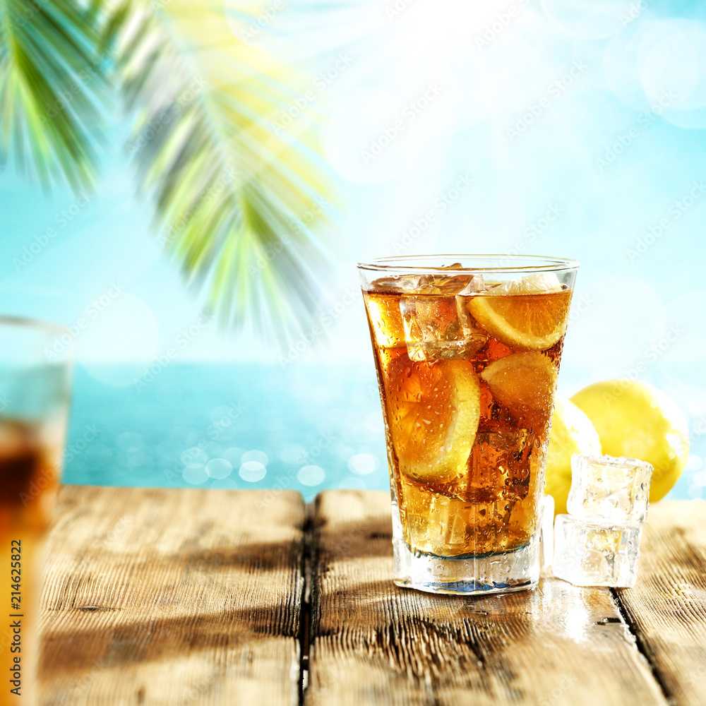 Summer drink of ice tea and palm Summer drink of ice tea and palm