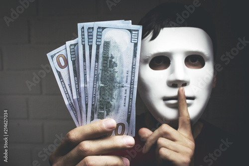 Foto Bribery people with dollar bills in hand and quiet gesture