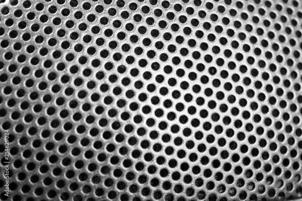 Steel grating of speaker or earphones. Abstract background Steel grating of speaker or earphones. Abstract background