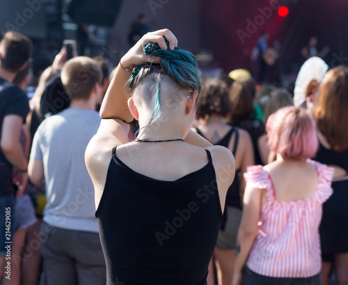 Girl having fun at summer festival concert 