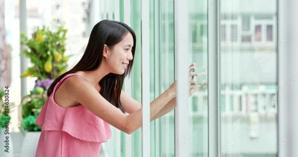 Woman taking photo on cellphone inside shopping mall Woman taking photo on cellphone inside shopping mall