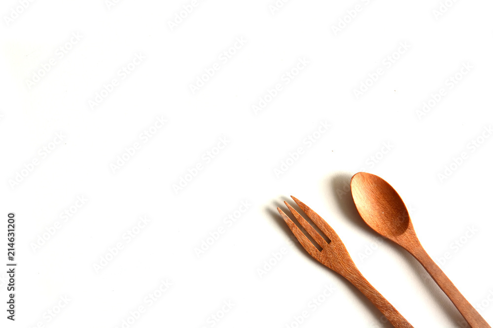 Wooden utensils on a white background,spoon,fork Wooden utensils on a white background,spoon,fork