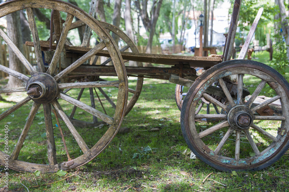 The old wooden cart is waiting in the front yard.