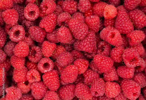 Ripe sweet raspberries close up. Raspberry fresh fruit background