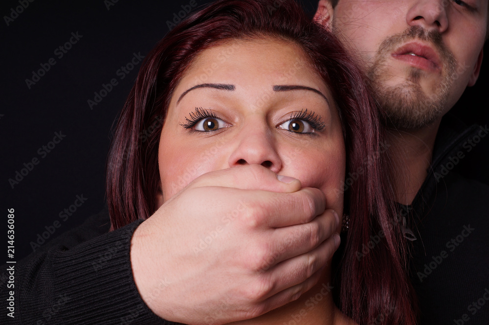 stranger covering the mouth of a terrified girl stranger covering the mouth of a terrified girl