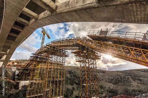 Construction of a bridge with cranes in the expansion works of the Madrid - Segovia - Valladolid highway. Fundamental axis of communications