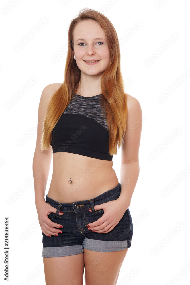 young woman wearing jeans hot pants and belly top Stock Photo | Adobe Stock
