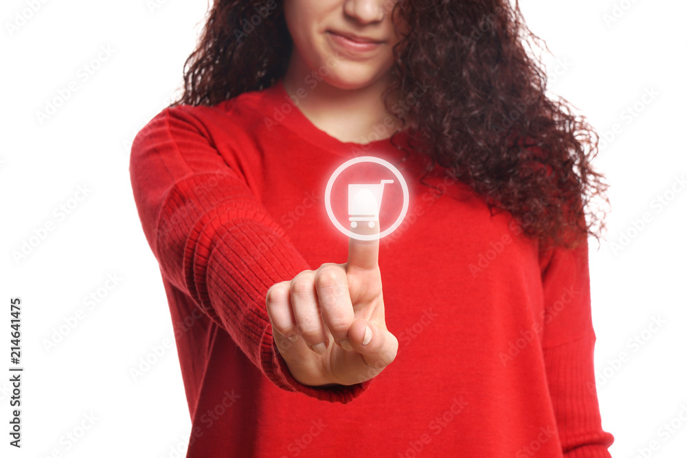 young woman pressing virtual button with shopping cart icon, online shopping concept young woman pressing virtual button with shopping cart icon, online shopping concept