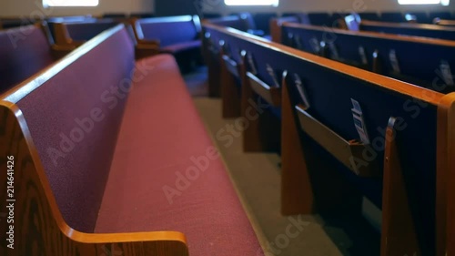Camera slider moves down church pews