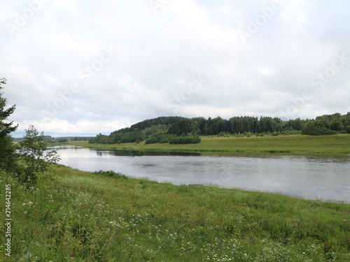 picturesque banks of the river in the summer evening