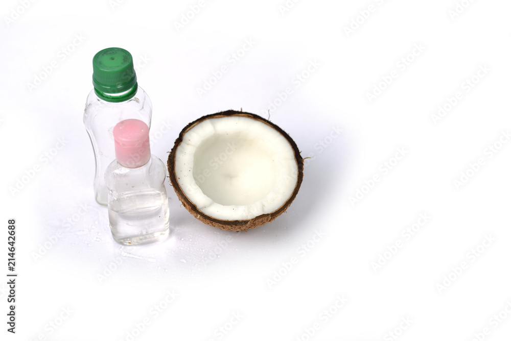 Coconut oil with coconut on white background.