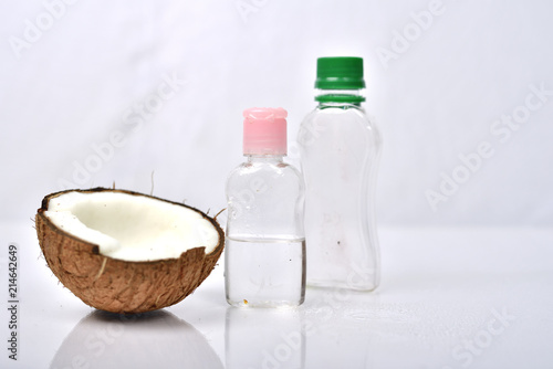 Coconut oil with coconut on white background.