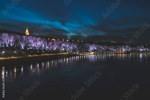 cityscape of the Moscow river embankment decorated to the new year, sparrow mountains © Nikita Petrov