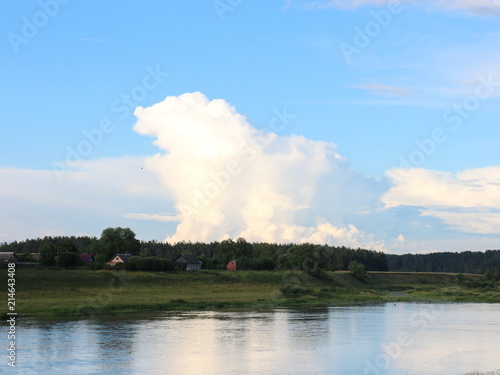 picturesque banks of the river in the summer evening