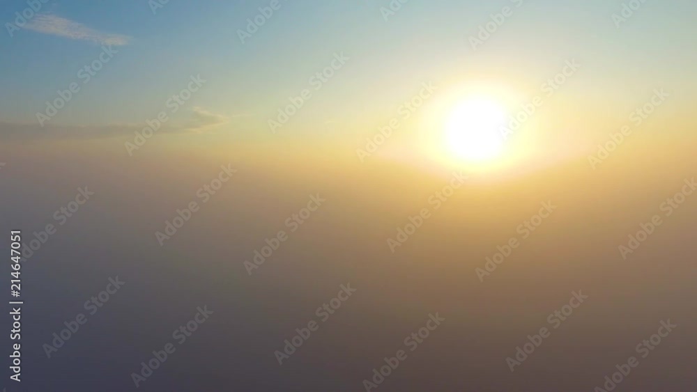 Flight over the clouds at dawn. Flight over the clouds at dawn.