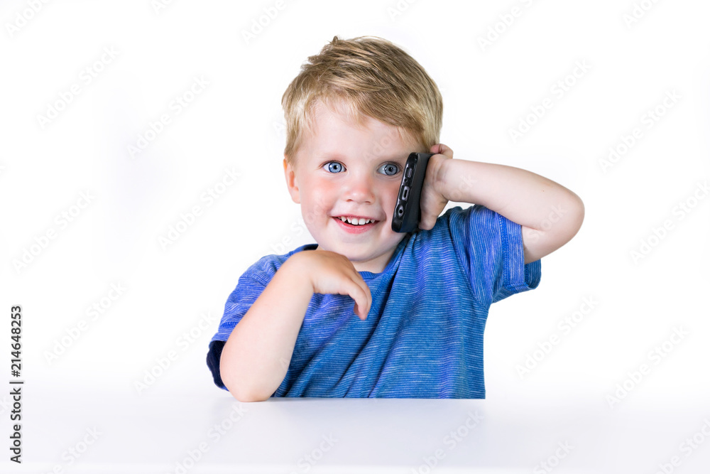 Kids education, developing, technology, mobile phone and internet concept, little child boy using smartphone on white background