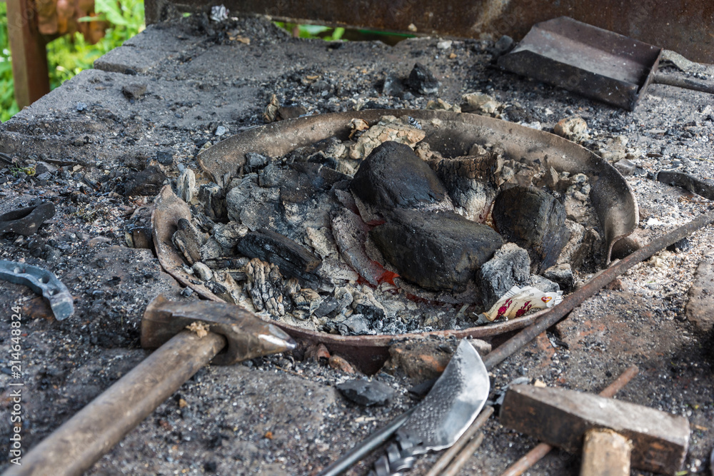Fototapeta premium A small forge with red burning coals.