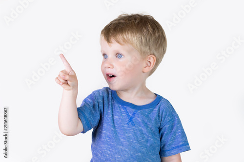 Portrait of cheerful kid boy showing good idea on fingers - isolated over white background