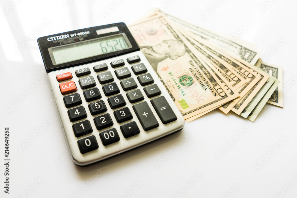 Close-up Money and Calculator, American Dollar Banknotes Close-up Money and Calculator, American Dollar Banknotes