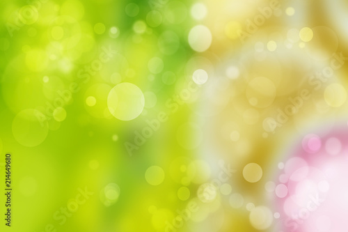Abstract colorful gradient green yellow bokeh lights background texture.