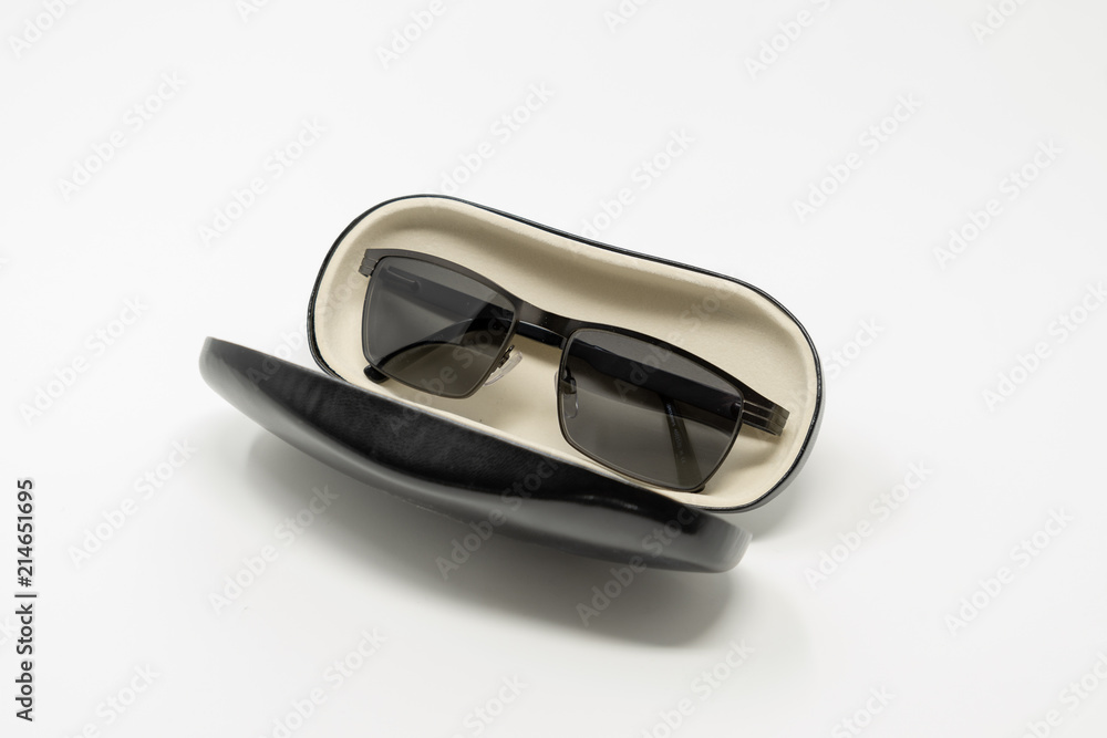 An open glasses case, containing a pair of sunglasses An open glasses case, containing a pair of sunglasses